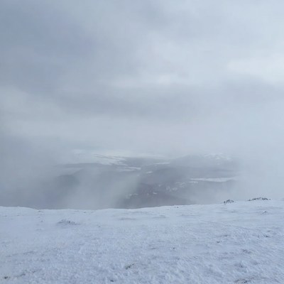 Snowy Mountain Landscape in Fog