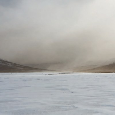 Snowy Valley in Foggy Mountains