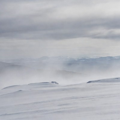 Snowy Mountains in Foggy Weather
