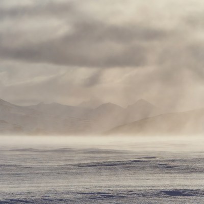 Snowy Mountains in Foggy Clouds