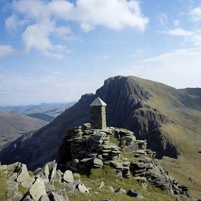 Stone summit cairn on mountain peak
