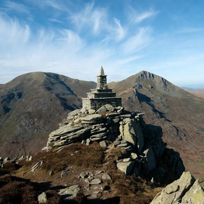 Stone Cairn Summit with Mountains