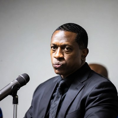 African-American man speaking at podium