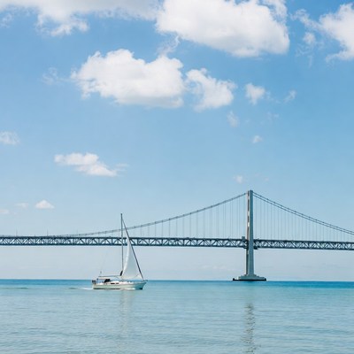 Sailboat under suspension bridge