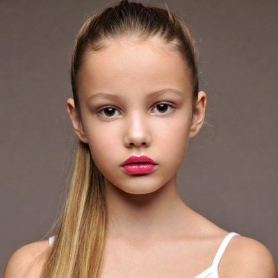 Girl with ponytail and pink lipstick