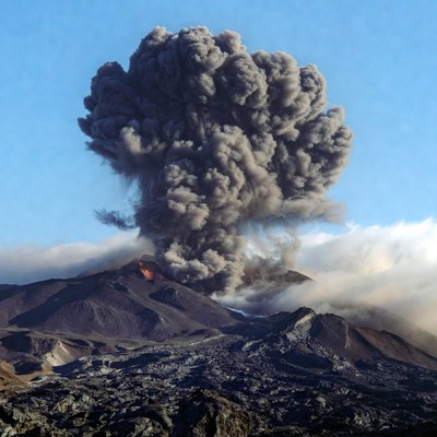 Volcano erupting with ash plume