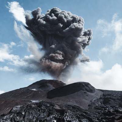 Volcano erupting with ash plume