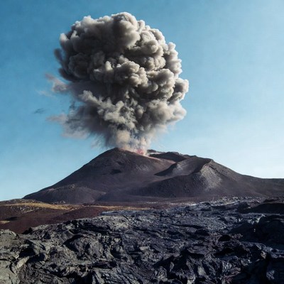 Volcano erupting with ash plume