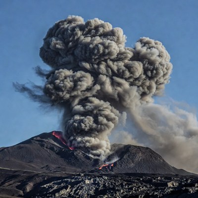 Volcano erupting with ash plume