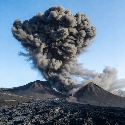 Volcano erupting ash plume