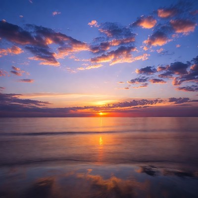 Sunset over ocean with reflection