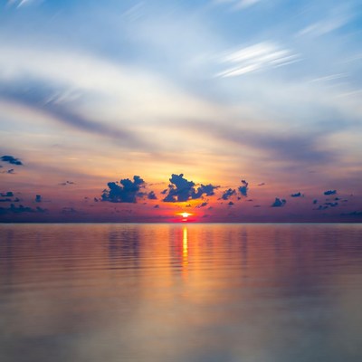 Sunset over calm ocean water