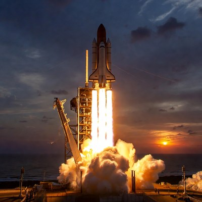 Space Shuttle Launching at Sunset