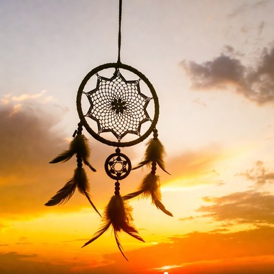 Dreamcatcher Hanging Against Sunset Sky