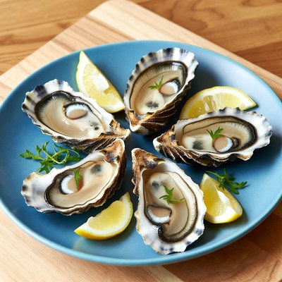 Fresh oysters on blue plate