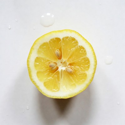 Sliced Lemon with Water Droplets