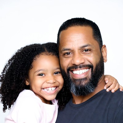 Smiling African-American father and daughter