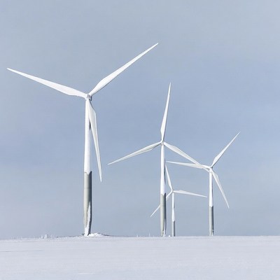 Wind Turbines in Snowy Field
