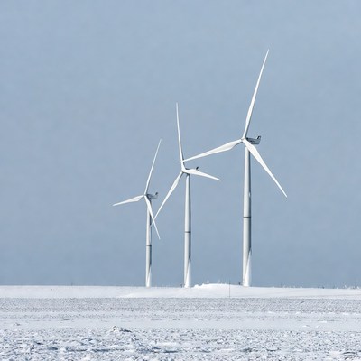 Wind Turbines in Snowy Field