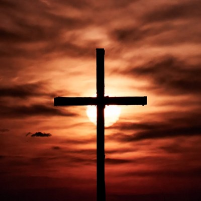 Cross Silhouette Against Sunset Sky