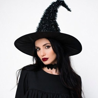 Woman wearing black witch hat