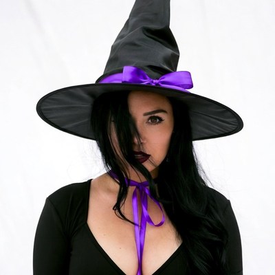 Woman in black witch hat