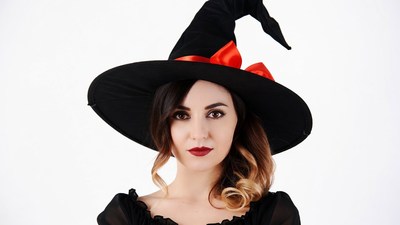 Woman wearing black witch hat