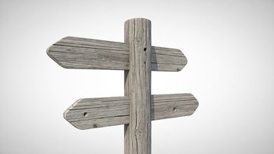 Rustic wooden direction signpost