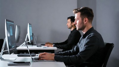 Two men working on computers