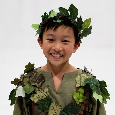 Asian boy in leafy costume