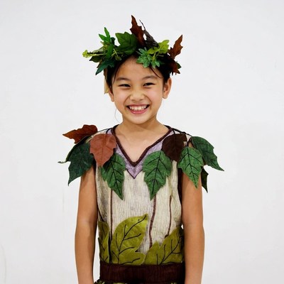 Asian girl in tree leaf costume
