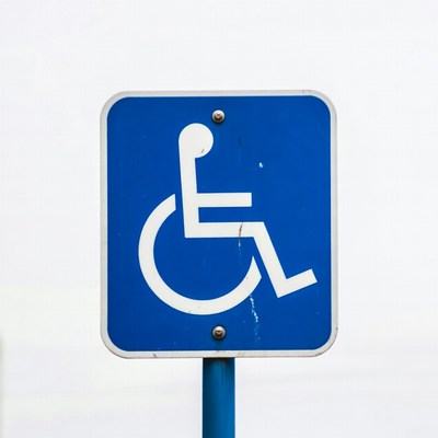 Blue wheelchair accessibility sign