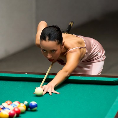 Asian woman playing pool