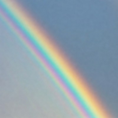 Vibrant Rainbow in Blue Sky