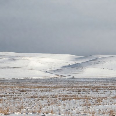 Snowy Hills with Winding Trail