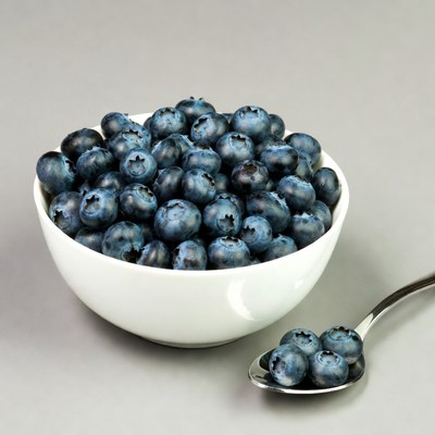 Bowl of blueberries with spoon