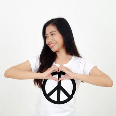 Asian woman making heart peace sign