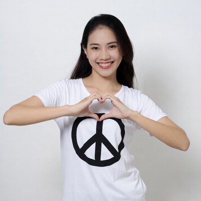 Asian woman making heart sign