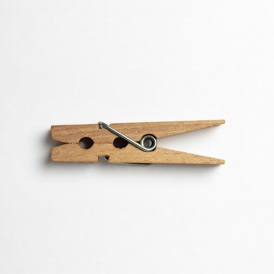 Wooden clothespin on white background