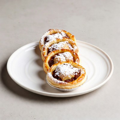 Four Custard Tarts with Powdered Sugar