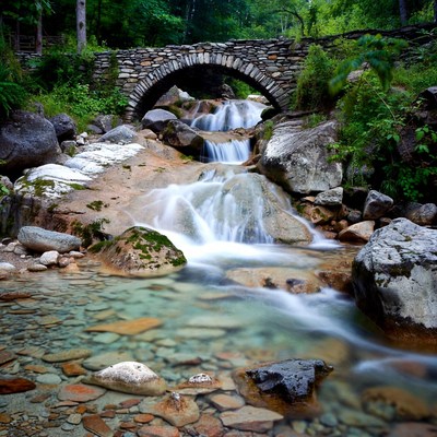 Stone Arch Bridge over Waterfall