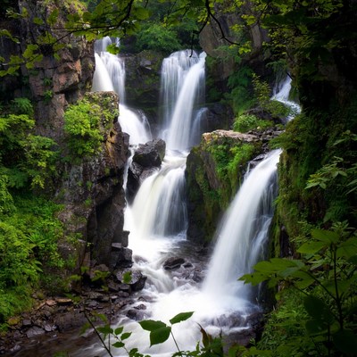 Majestic Multi-Tiered Waterfall in Forest