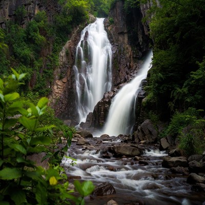 Majestic waterfall cascading between rocky cliffs