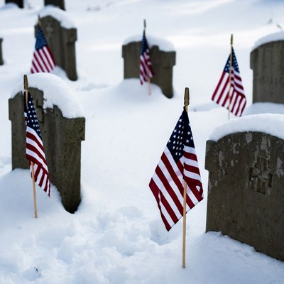 American Flags on Snowy Graves