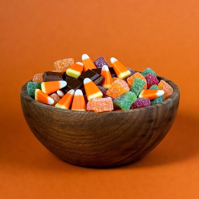 Wooden bowl of candy corn and jelly beans