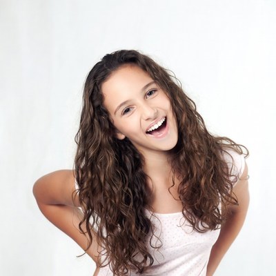 Smiling girl with curly hair