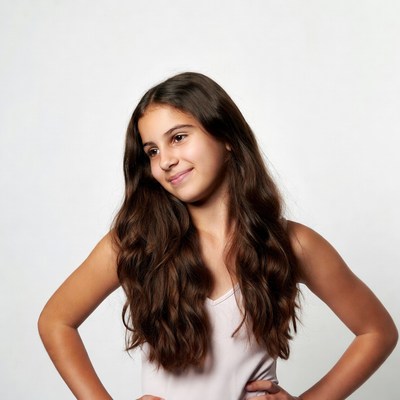 Smiling girl with hands on hips