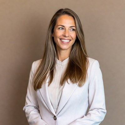 Smiling woman in white blazer
