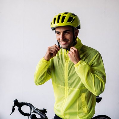Man wearing yellow helmet with bike