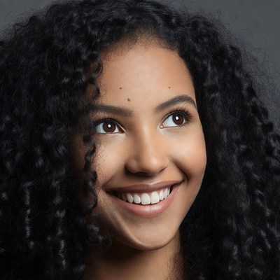 Smiling woman with curly black hair